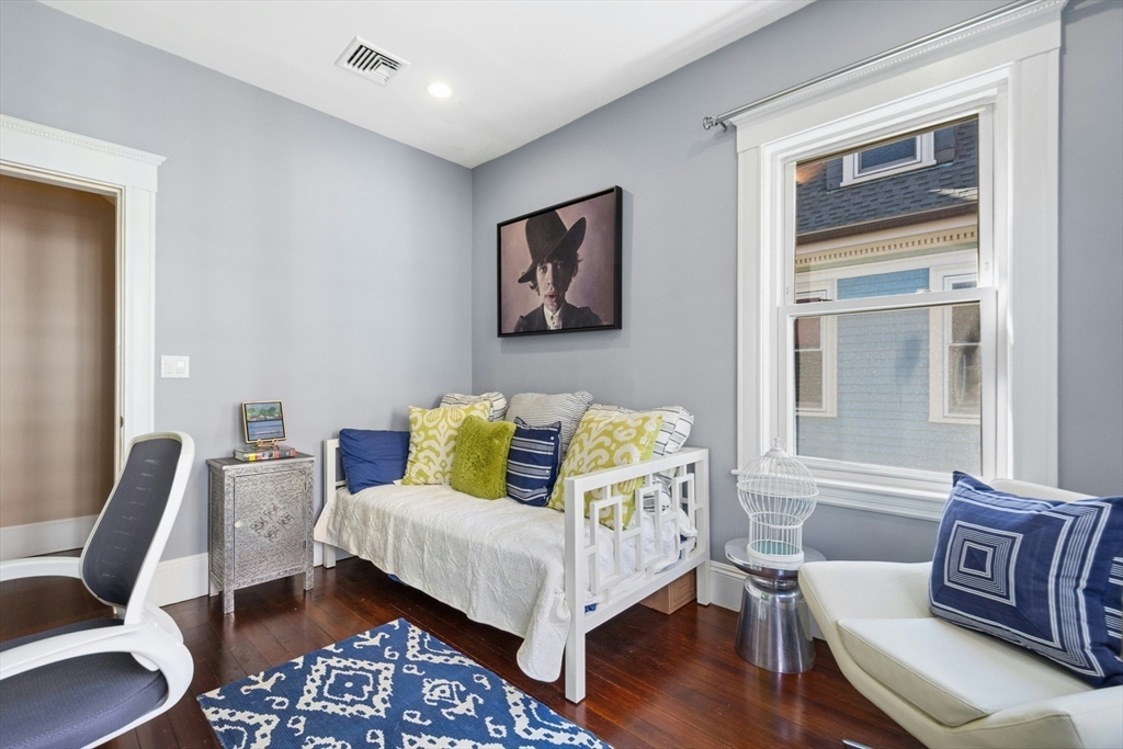 15 Oakview Terrace, Unit 2 Boston, MA 02130 - Photo 15 of 29 a bed room with a bed and a couch