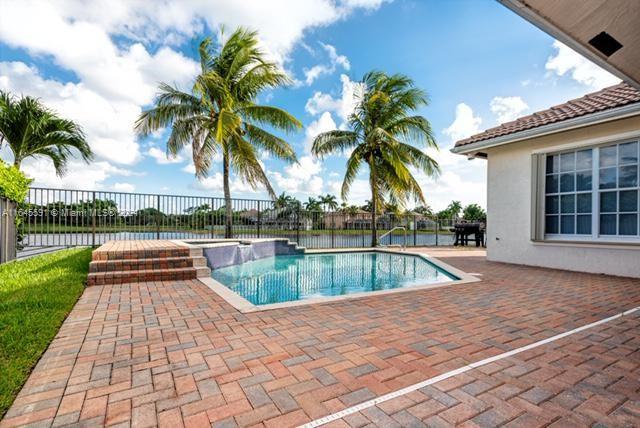 1737 Harbor View Circle Weston, FL 33327 - Photo 14 of 15 a view of swimming pool with a lounge chair