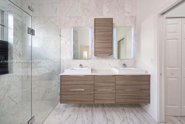 1737 Harbor View Circle Weston, FL 33327 - Photo 5 of 15 a bathroom with a sink mirror and shower