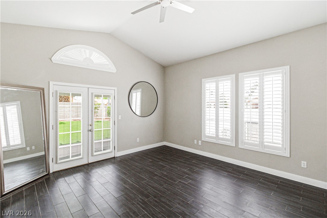 9523 Observer Street Las Vegas, NV 89123 - Photo 14 of 42 Sliding glass doors offer a seamless transition to outdoor living from this inviting room with vaulted ceilings.