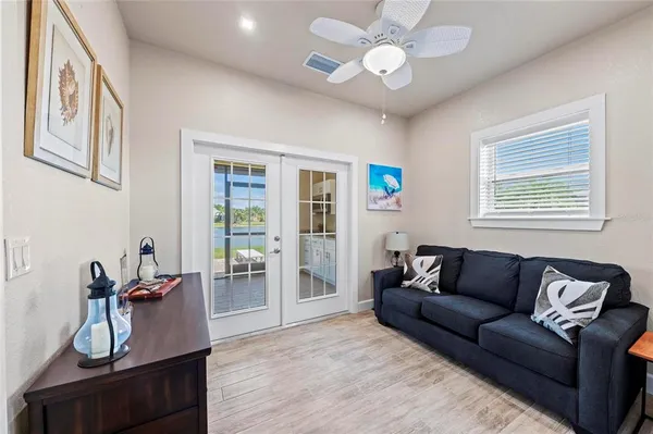 a living room with furniture and wooden floor