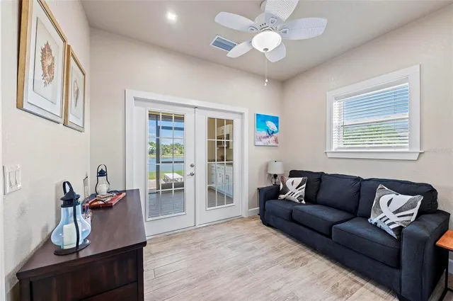 a living room with furniture and wooden floor