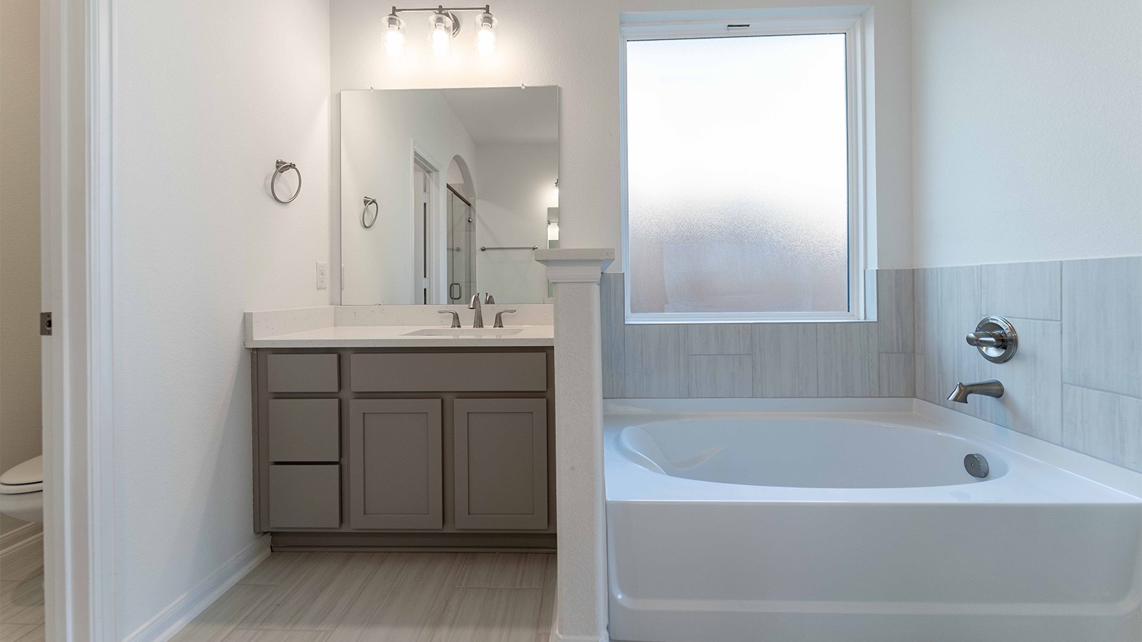 294 Rubber Tree Way Buda, TX 78610 - Photo 8 of 19 Bathroom featuring vanity and a bath