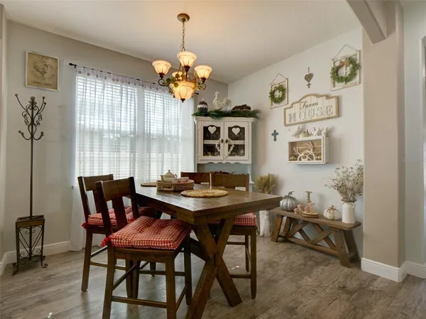 a view of a dining room with furniture window and outside view