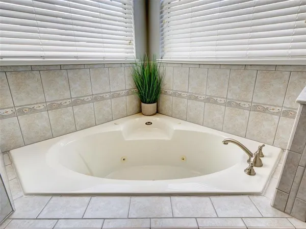 a white bath tub sitting in a bathroom