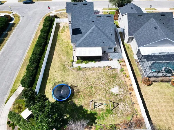 an aerial view of a house with a swimming pool
