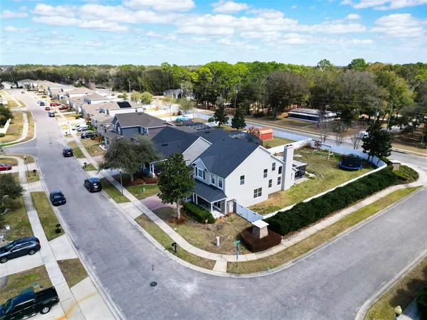 an aerial view of residential houses with outdoor space