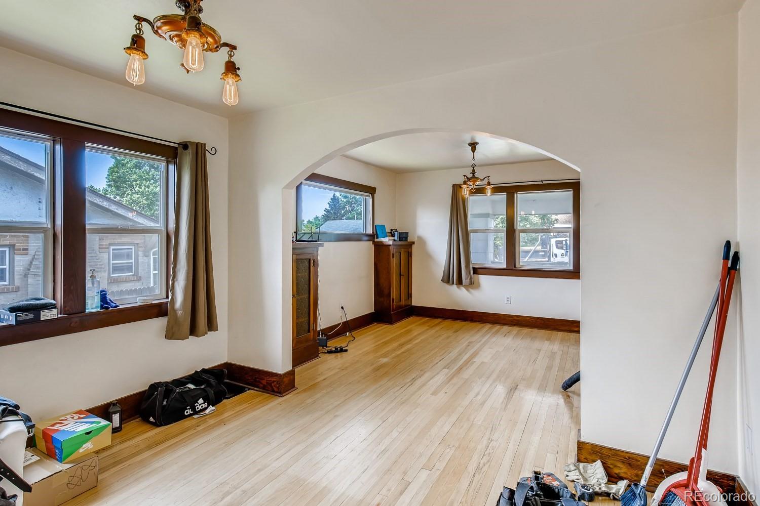 2910 Ames Street Wheat Ridge, CO 80214 - Photo 7 of 30 wooden floor in an empty room with a window