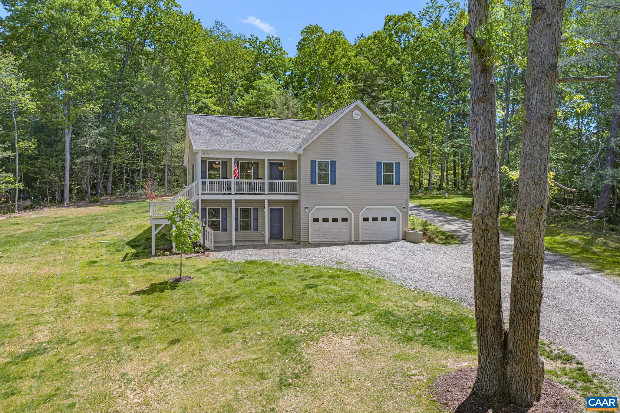 230 Fox Hollow Road Ruckersville, VA 22968 - Photo 1 of 42 a view of a house with backyard and a tree
