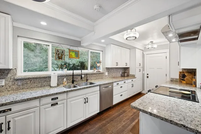 a bathroom with a toilet mirror vanity and vanity