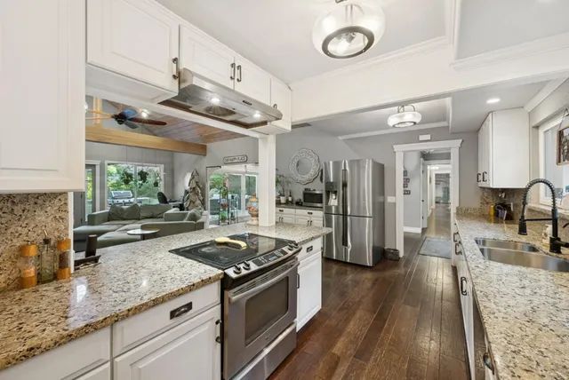 a room with a bed and furniture