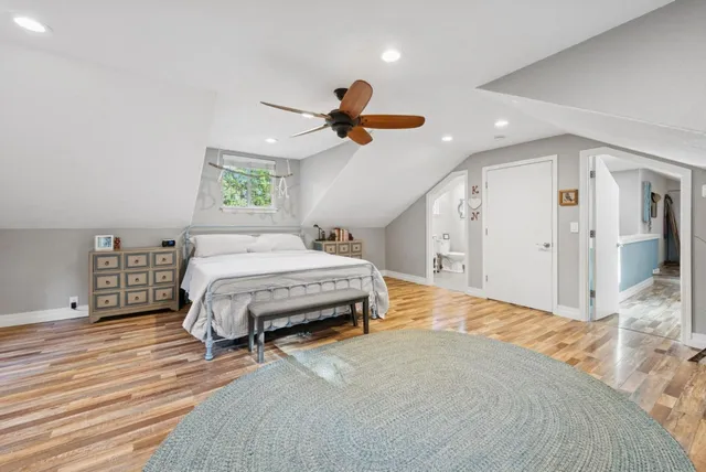 a view of a workspace with furniture and wooden floor