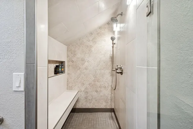a view of a hallway with wooden floor and closet