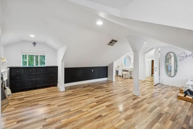 an aerial view of a house with a yard basket ball court