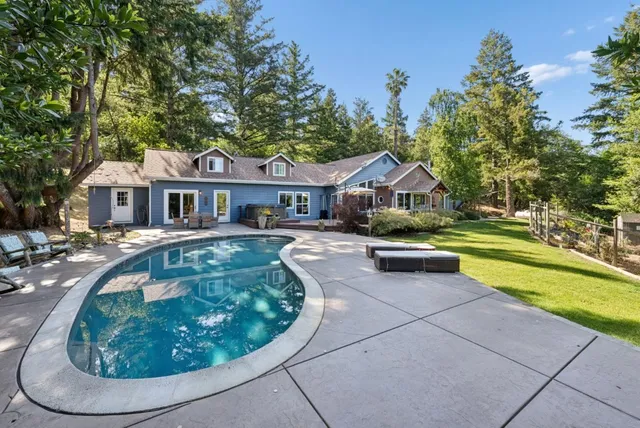 a front view of a house with a yard and porch