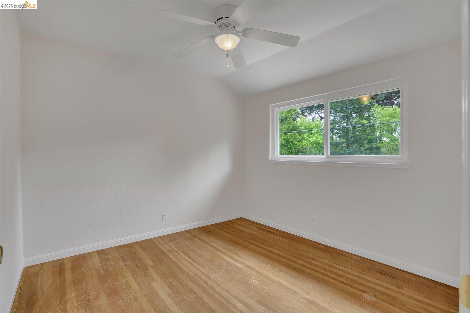 1878 Polk Street Concord, CA 94521 - Photo 19 of 40 a view of empty room with wooden floor