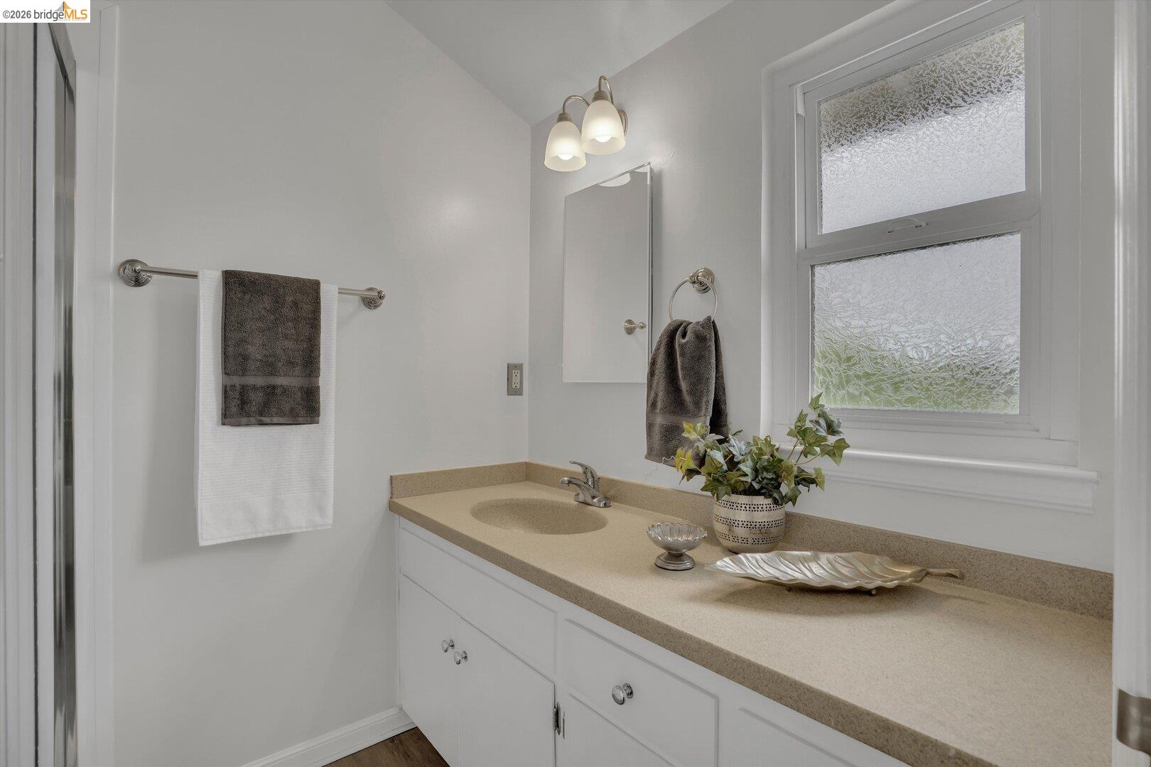 1878 Polk Street Concord, CA 94521 - Photo 21 of 40 a bathroom with a sink and a mirror