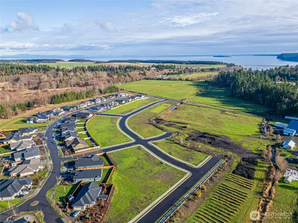 a view of swimming pool with garden and seating
