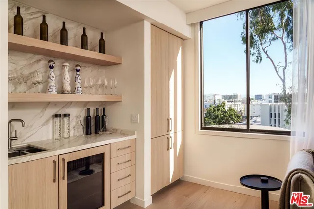 a kitchen with appliances cabinets and a window