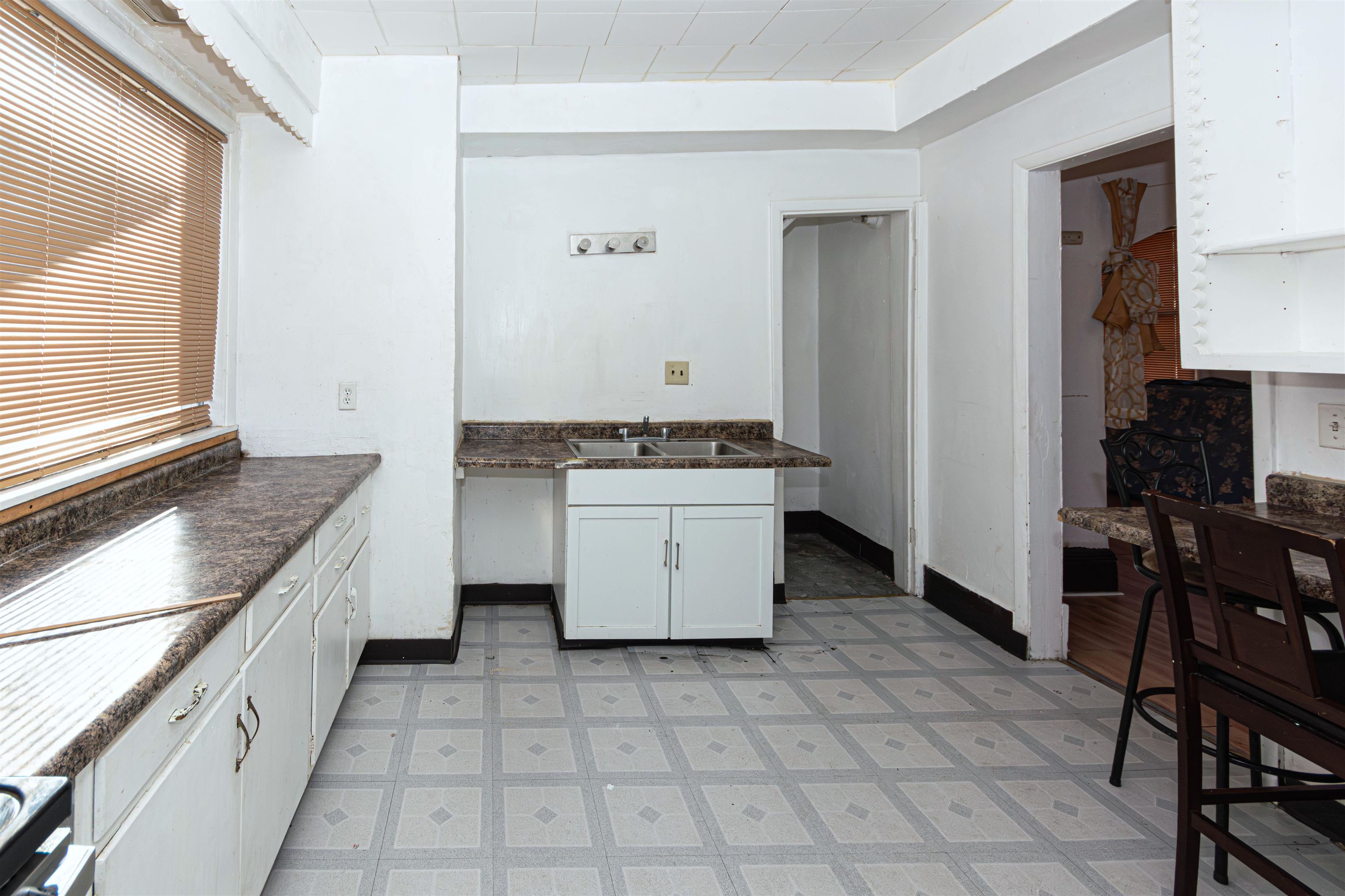 1017 Ridge Avenue Rockford, IL 61103 - Photo 13 of 20 a kitchen with a stove top oven cabinets and a counter top space