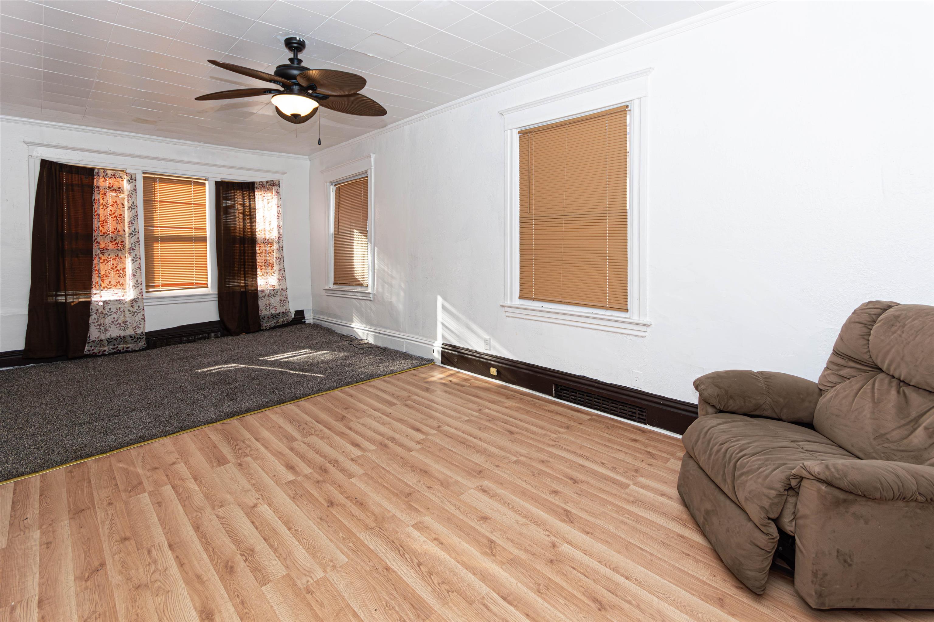1017 Ridge Avenue Rockford, IL 61103 - Photo 14 of 20 a living room with furniture and a window