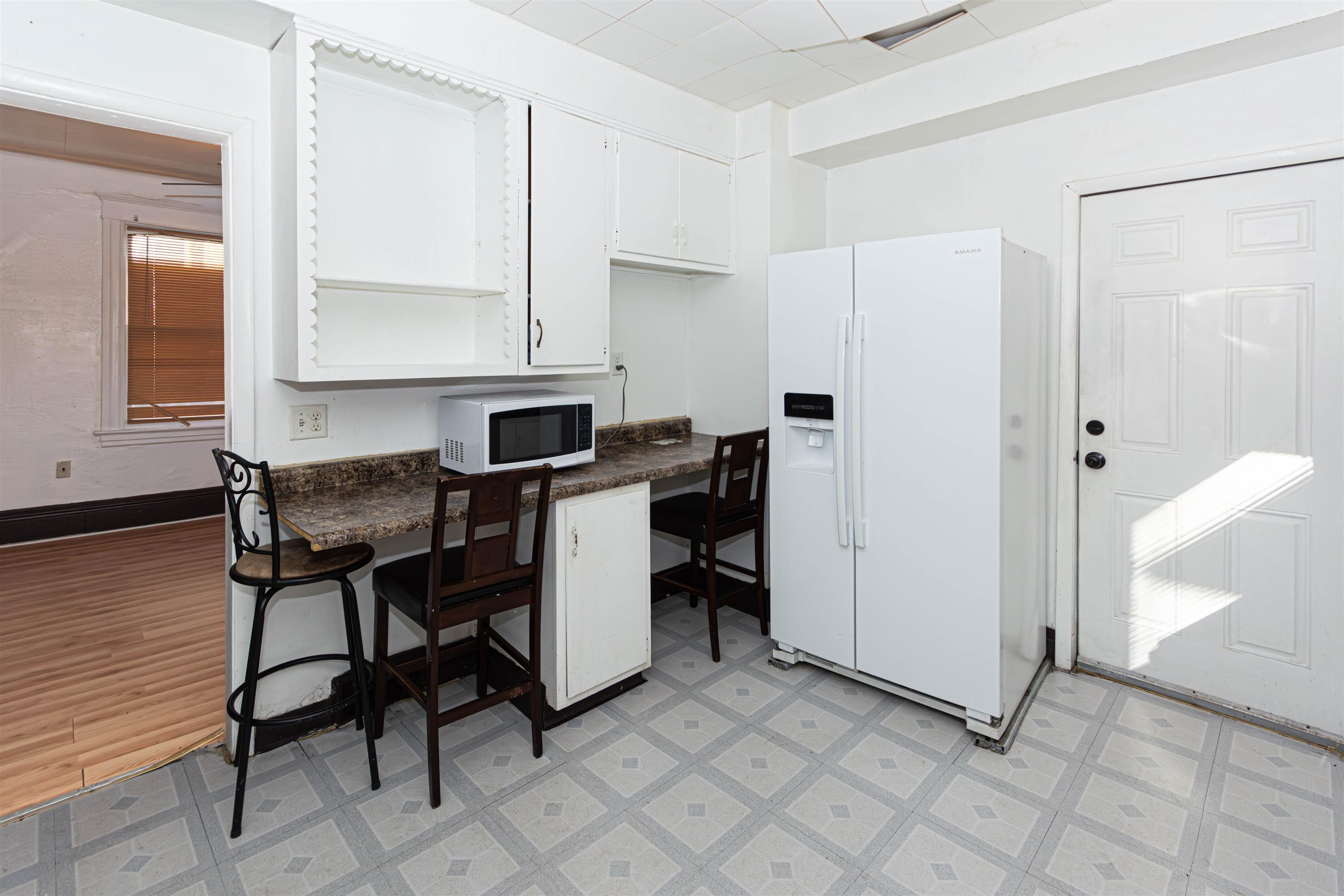 1017 Ridge Avenue Rockford, IL 61103 - Photo 19 of 20 a view of a workspace with furniture and a window
