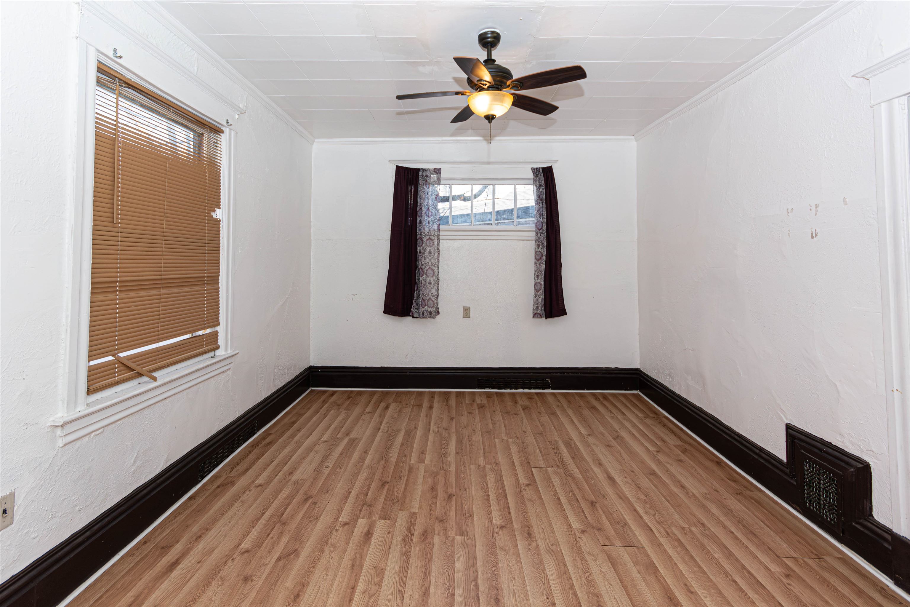 1017 Ridge Avenue Rockford, IL 61103 - Photo 4 of 20 a view of empty room with wooden floor and fan
