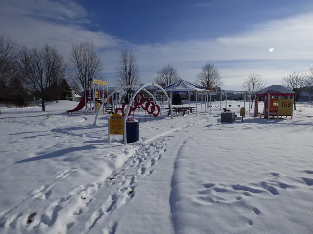 a view of a patio with a table and chairs under an umbrella