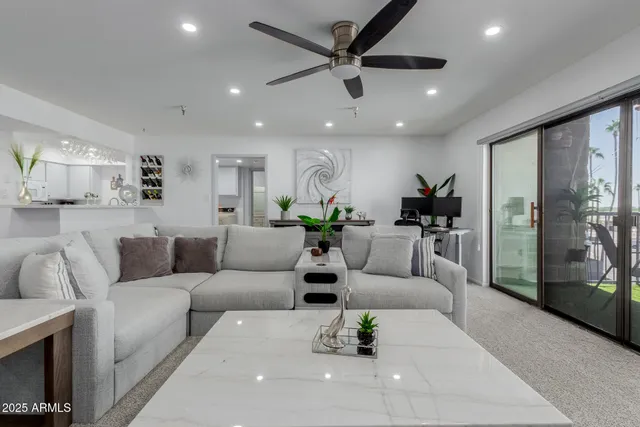 a living room with furniture and a large window