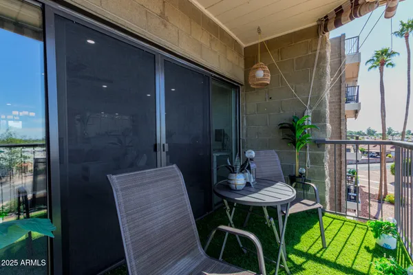 a view of a balcony with chairs