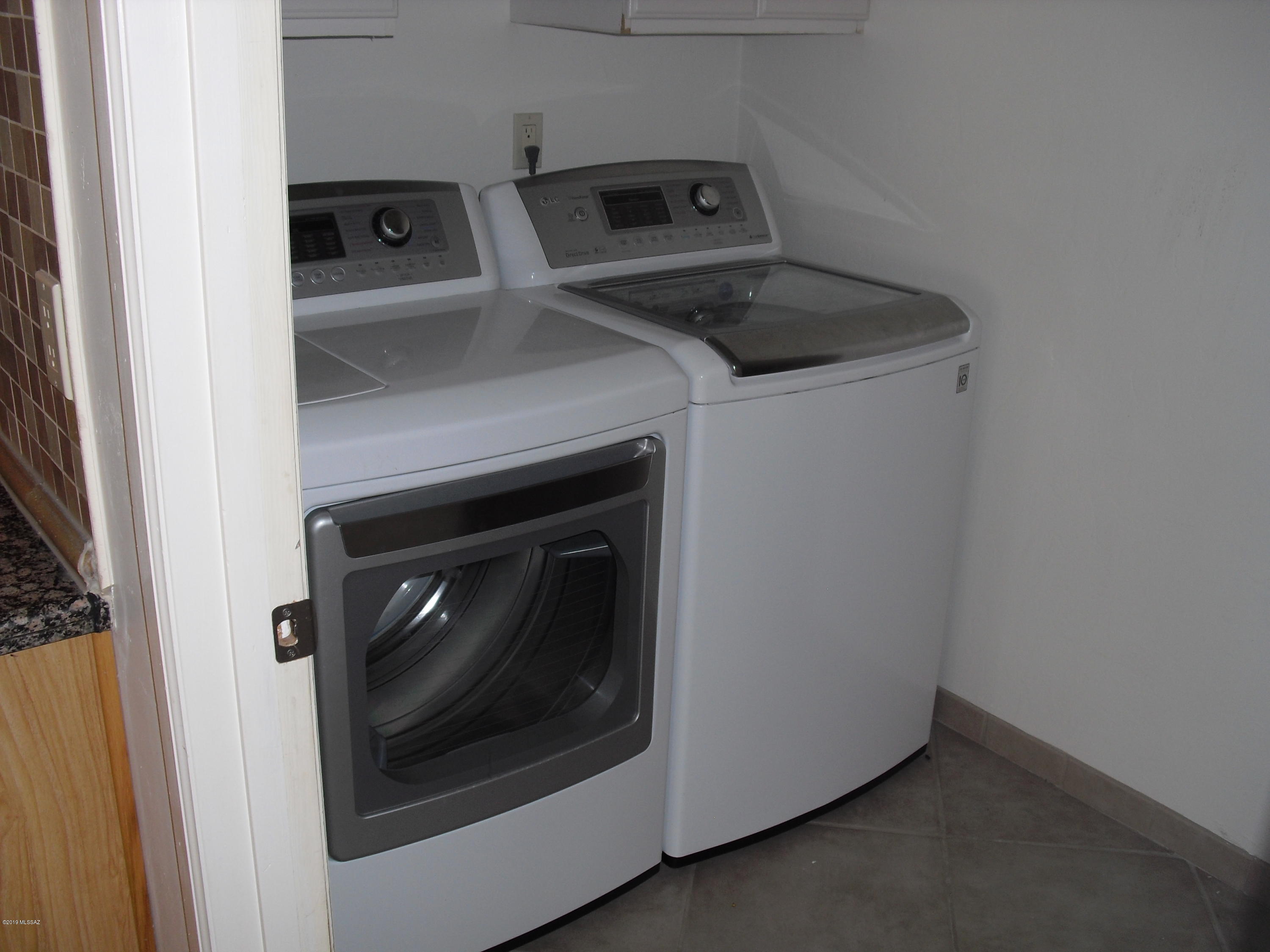 402 Hopkins Street Rio Rico, AZ 85648 - Photo 5 of 14 a utility room with dryer and washer