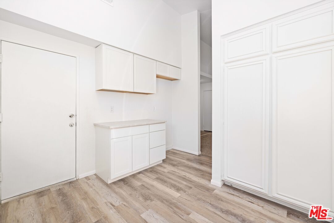 1415 Kings Road Palmdale, CA 93551 - Photo 11 of 27 an empty room with wooden floor