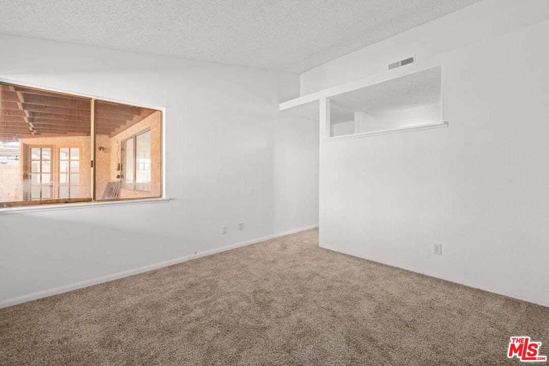 1415 Kings Road Palmdale, CA 93551 - Photo 15 of 27 an empty room with a window