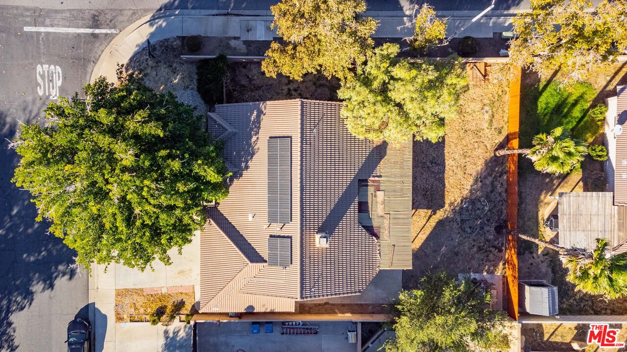 1415 Kings Road Palmdale, CA 93551 - Photo 27 of 27 a house with lots of trees