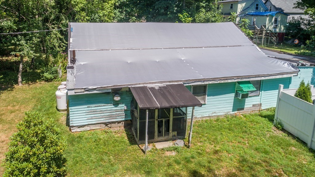 23 Bennett Lane Lancaster, MA 01523 - Photo 2 of 4 aerial view of a house with a yard