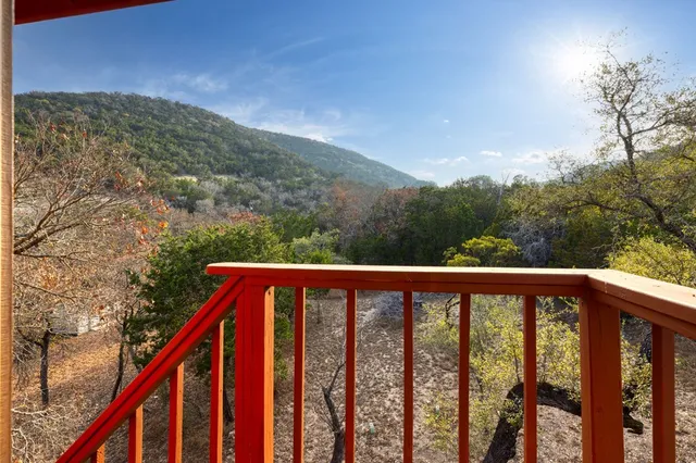 a view of a balcony with an outdoor space