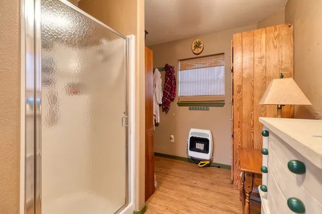 a view of an entryway with wooden floor