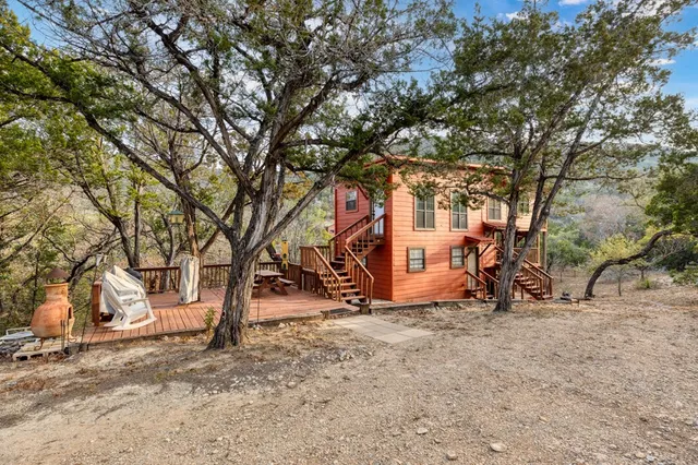 a view of outdoor space with deck and tree