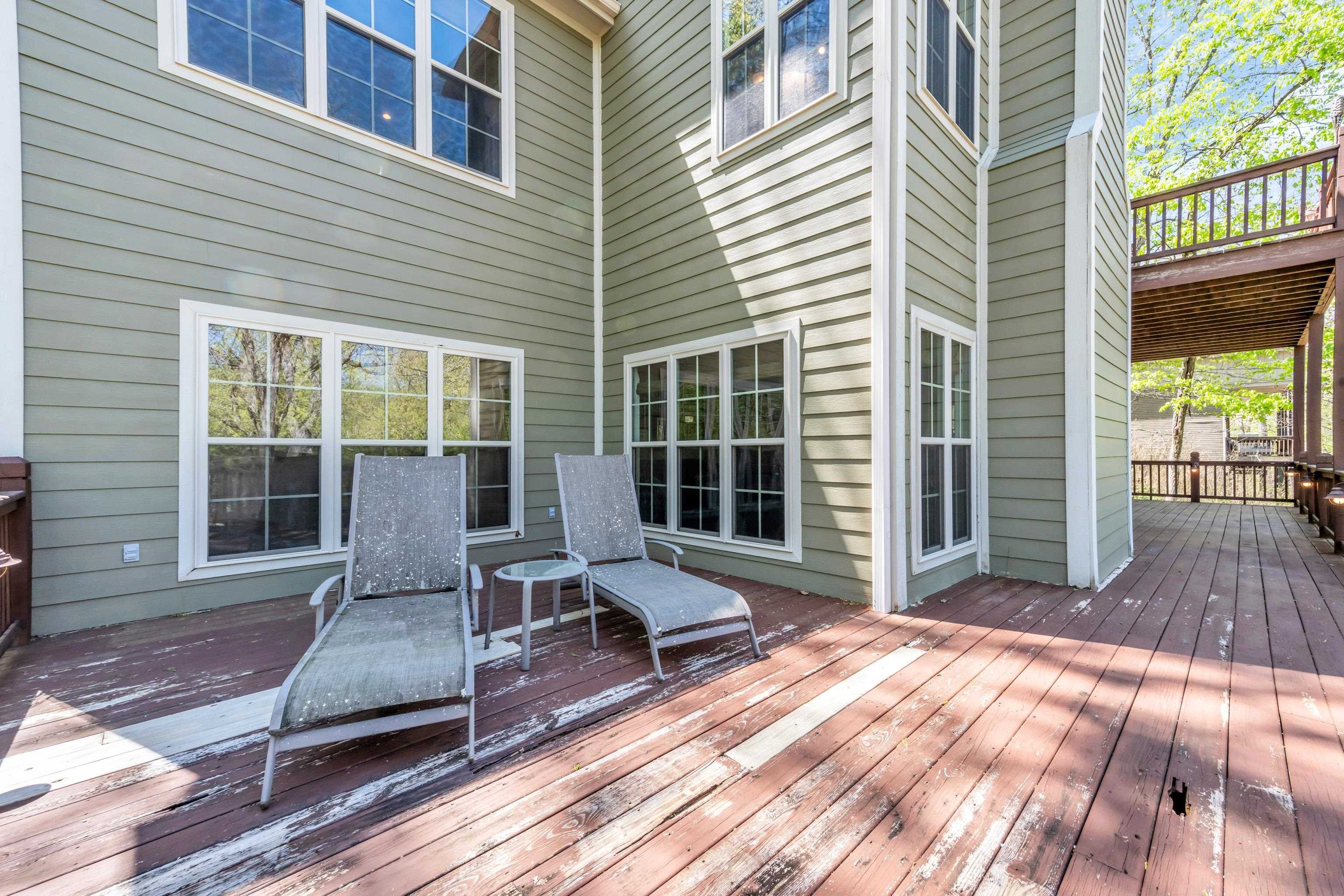 a view of a two chairs in the deck