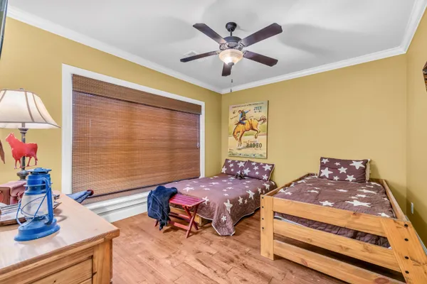 a bedroom with a large bed and a window