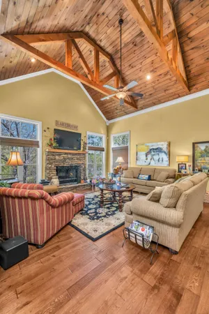 a living room with furniture fireplace and a flat screen tv