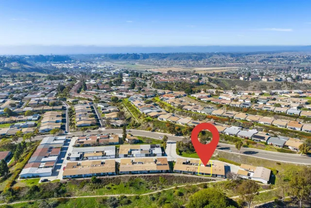 an aerial view of residential houses and city view