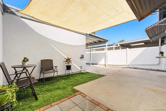 an aerial view of a house with yard swimming pool and outdoor seating