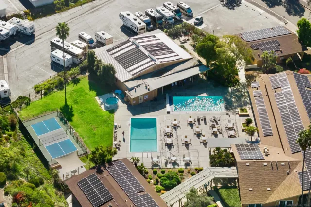 a view of an empty room with a ceiling fan