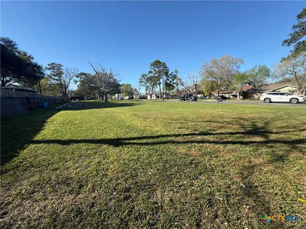 a view of a garden with houses