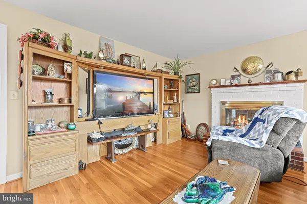 a living room with furniture large window and a table