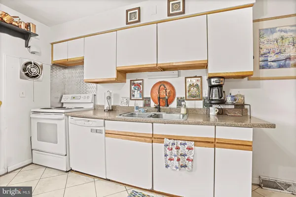 a view of a livingroom with lots of furniture and natural light