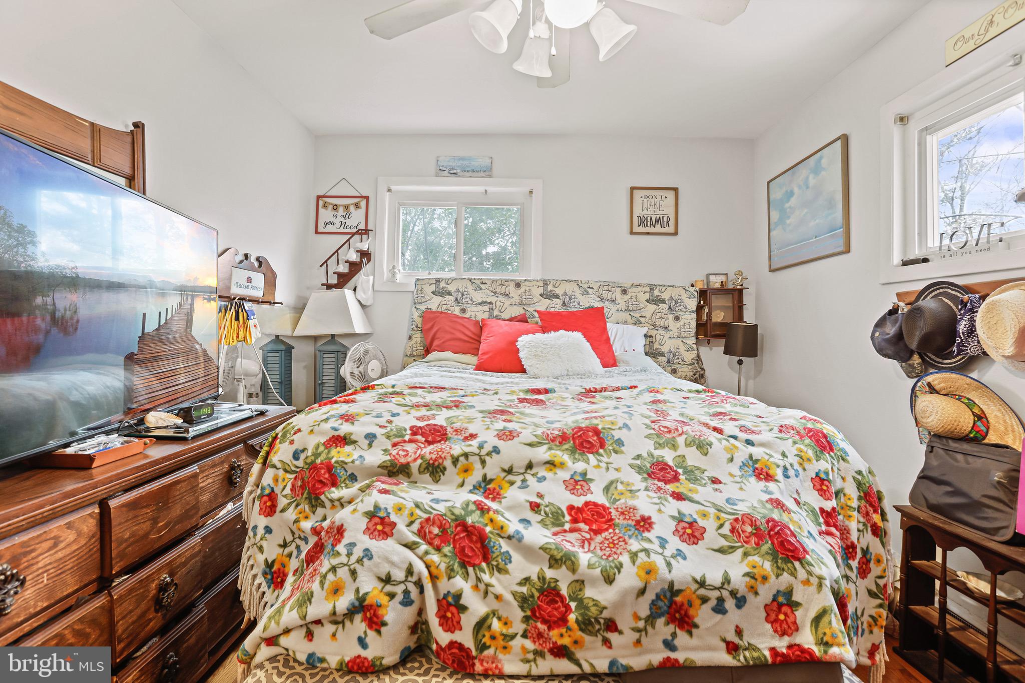 3504 Wakefield Street Colonial Beach, VA 22443 - Photo 20 of 53 a bedroom with a bed and wooden floor