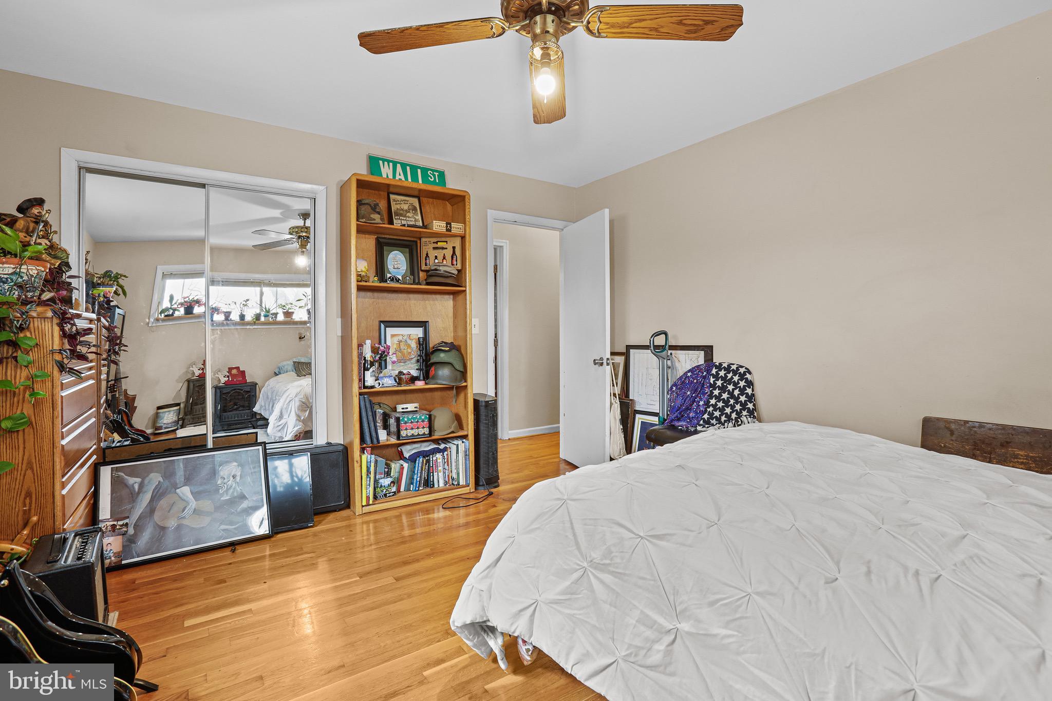 3504 Wakefield Street Colonial Beach, VA 22443 - Photo 25 of 53 a bedroom with a large bed and a flat tv screen on dresser