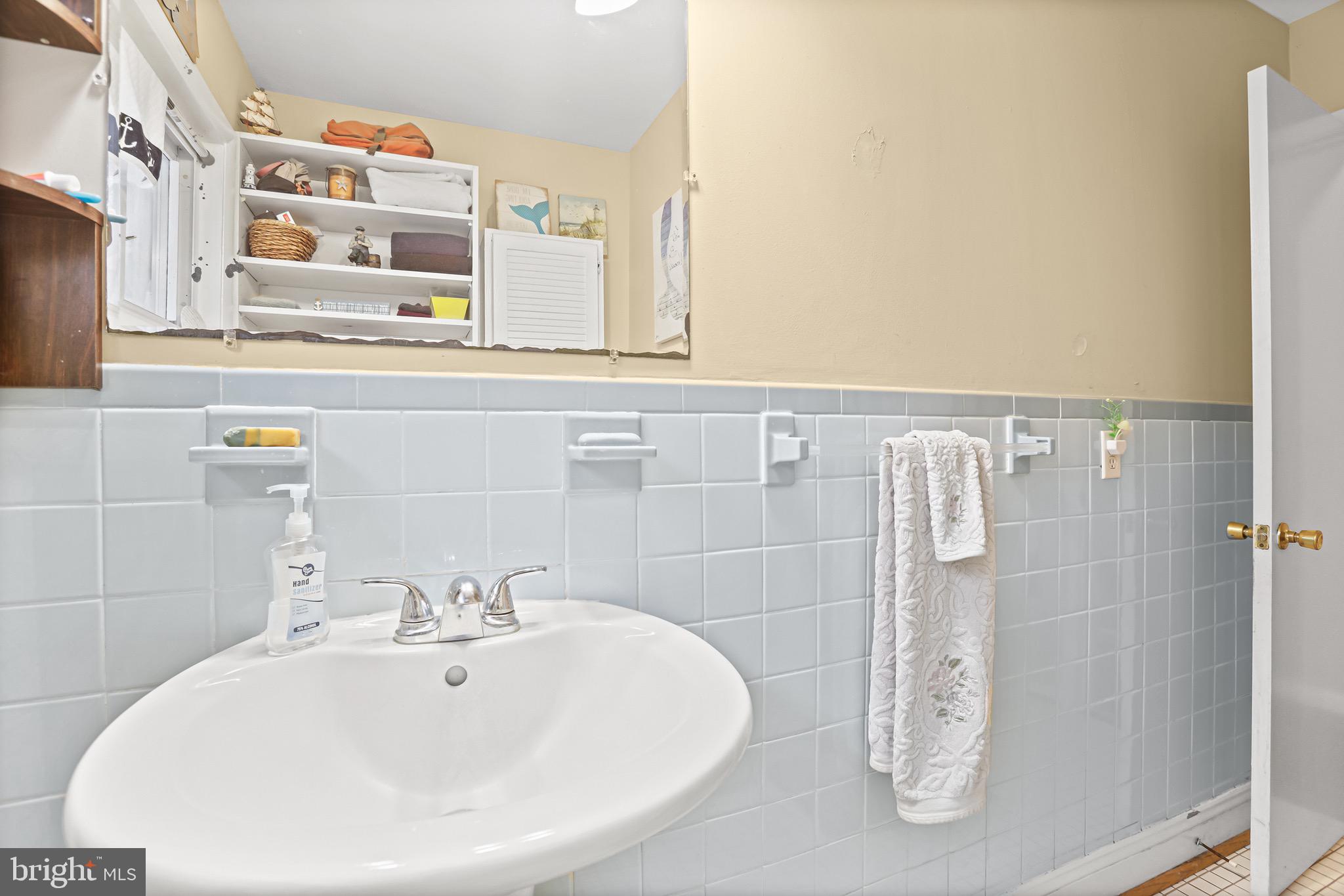 3504 Wakefield Street Colonial Beach, VA 22443 - Photo 28 of 53 a bathroom with a sink and a mirror